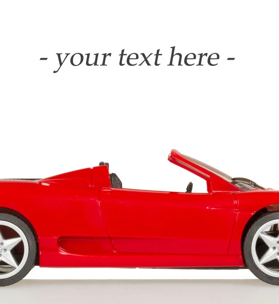 Une voiture jouet, cicatrice sportive rouge, chambre pour le texte — Photo