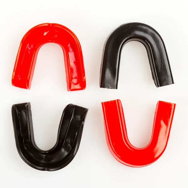 Four simple mouthguards isolated — Stock Photo, Image