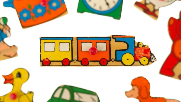 Piece of an antique wooden puzzle for children — Stock Photo, Image