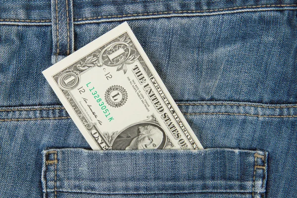 Macro shot of trendy jeans with american 1 dollar bill — Stock Photo, Image