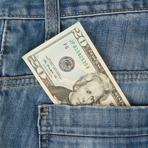 Macro shot of trendy jeans with american 20 dollar bill — Stock Photo, Image