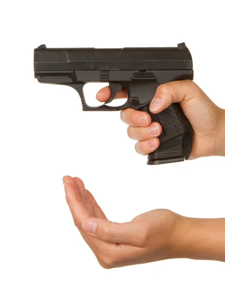 Woman threatening with a black gun — Stock Photo, Image