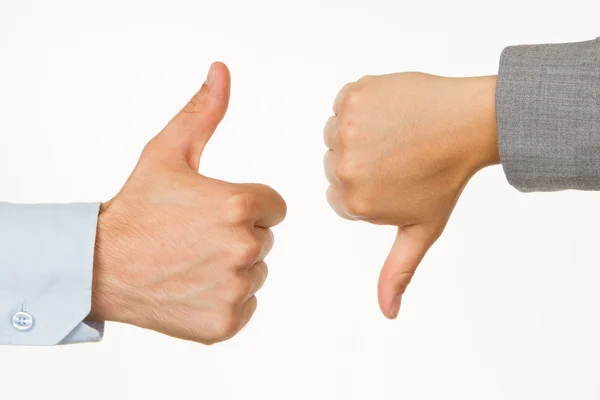 Caucasian business man and woman holding thumb up and down — Stock Photo, Image
