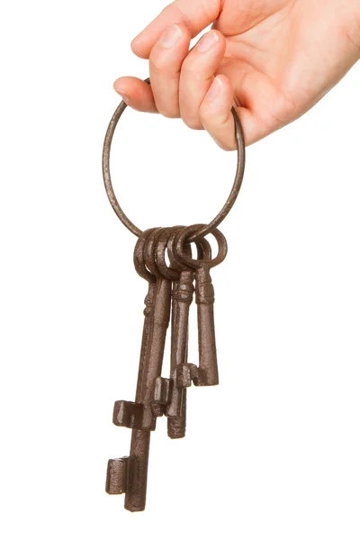 Gamla rostiga massa nycklar i hand — Stockfoto
