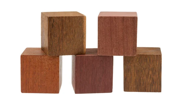 Several old cubes of wood, used by children for building — Stock Photo, Image