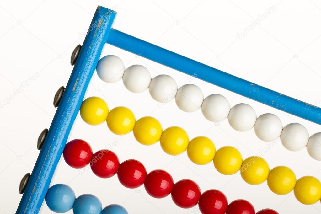 Close-up of an abacus on a white background