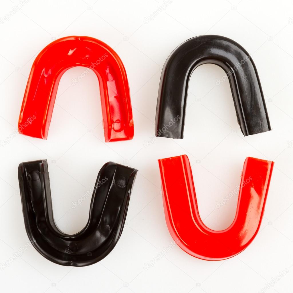 Four simple mouthguards isolated