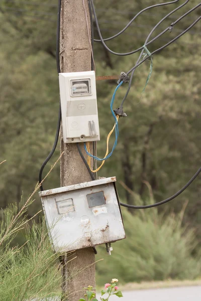 Cabinet with electrical meter on a concrete pole — Stock Photo, Image