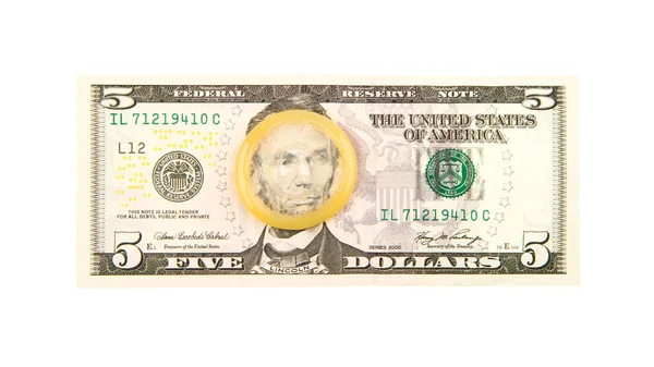 Condom on the US dollars bill — Stock Photo, Image
