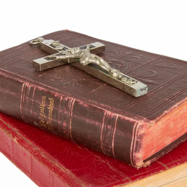 Old antique bible and cross on a white background — Stock Photo, Image