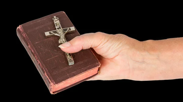 Old hand (woman) holding a very old bible — Stock Photo, Image