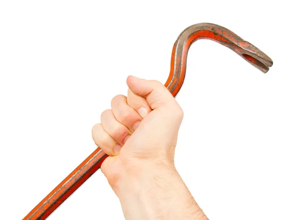 Hand holding old red crowbar — Stock Photo, Image