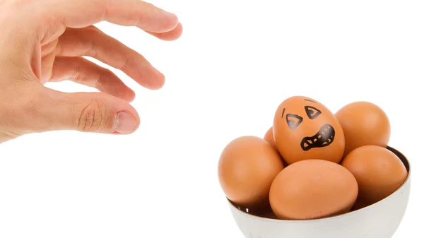 Scared egg, waiting to be grabbed by a hand — Stock Photo, Image