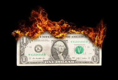 dikkatsiz para yönetimi simgeleyen yanan dolar