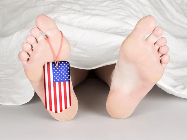 USA flaggan tag på foten — Stockfoto