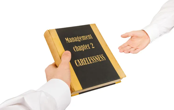 Businessman giving an used book to another businessman — Stock Photo, Image