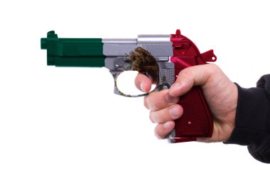 Pistol with Mexican flag pattern in hand clipart