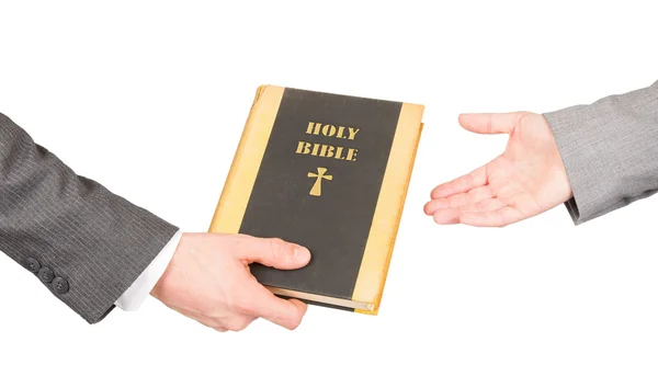 Man and woman in business suits are holding a holy bible — Stock Photo, Image