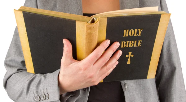 Woman in business suit is reading a holy bible — Stock Photo, Image