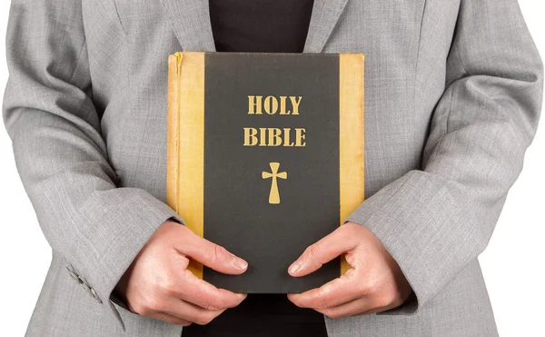 Woman in business suit is holding a holy bible — Stock Photo, Image