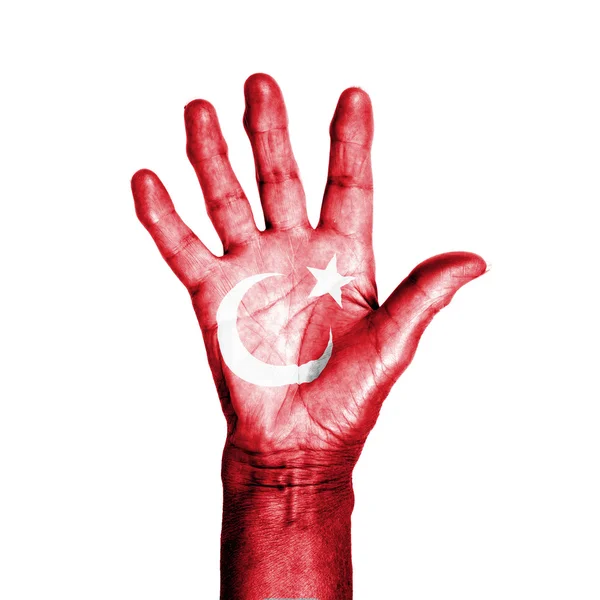 Hand of an old woman, wrapped with a pattern of the flag of Turk — Stock Photo, Image