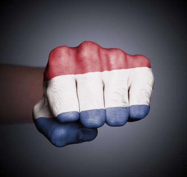 Front view of punching fist on gray background — Stock Photo, Image