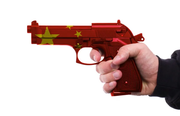Πιστόλι με μοτίβο κινεζική σημαία στο χέρι — Φωτογραφία Αρχείου