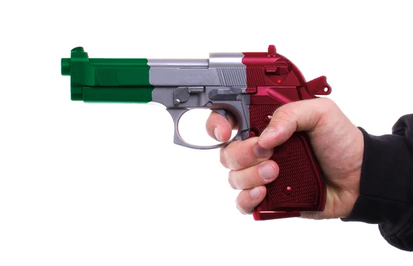 Pistola com padrão de bandeira italiana na mão — Fotografia de Stock