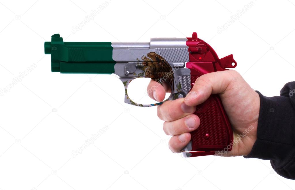 Pistol with Mexican flag pattern in hand