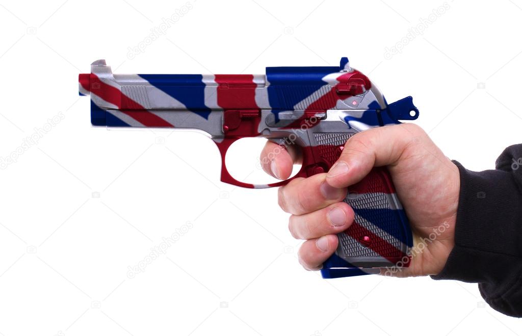 Pistol with UK flag pattern in hand