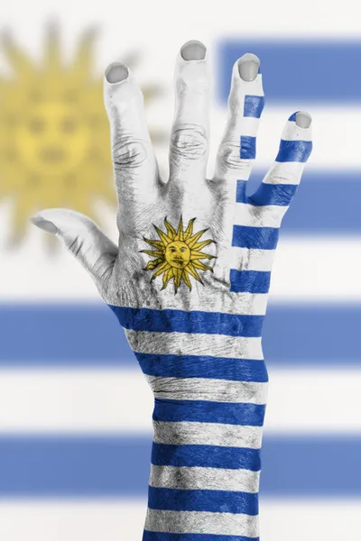 Hand of an old woman wrapped in flag — Stock Photo, Image