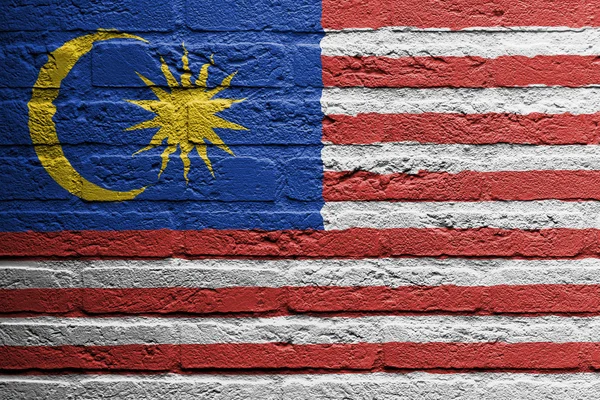 Ziegelsteinmauer mit einem Bild einer Flagge, Malaysia — Stockfoto