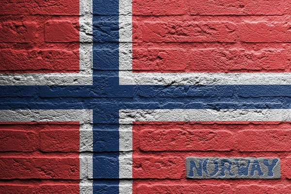 Pared de ladrillo con una pintura de una bandera —  Fotos de Stock