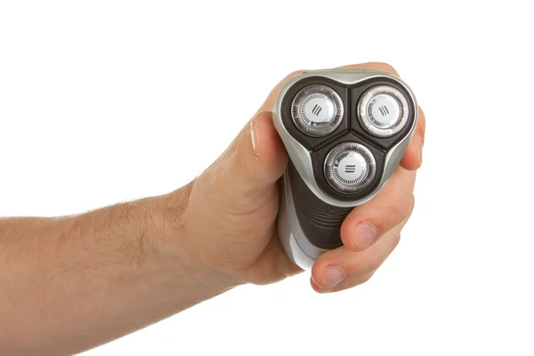 Hand holding an electric shaver — Stock Photo, Image