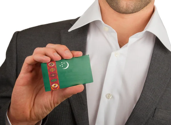 Businessman is holding a business card, Turkmenistan — Stock Photo, Image