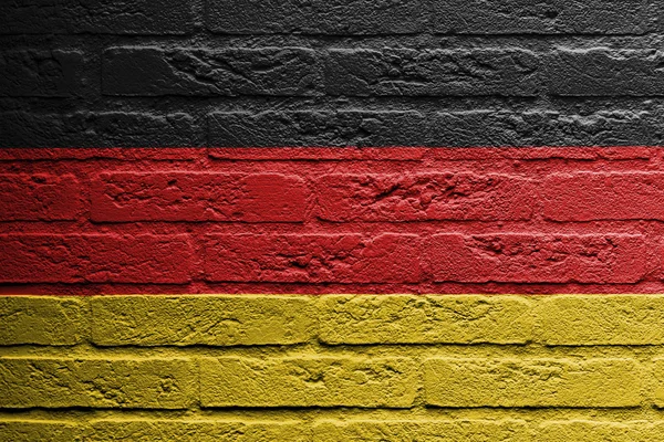 Brick wall with a painting of a flag — Stock Photo, Image