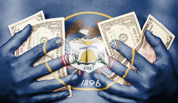 Sweaty girl covered her breast with money, flag of Utah — Stock Photo, Image