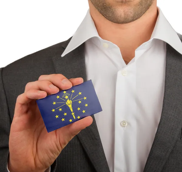 Businessman is holding a business card, Indiana — Stock Photo, Image