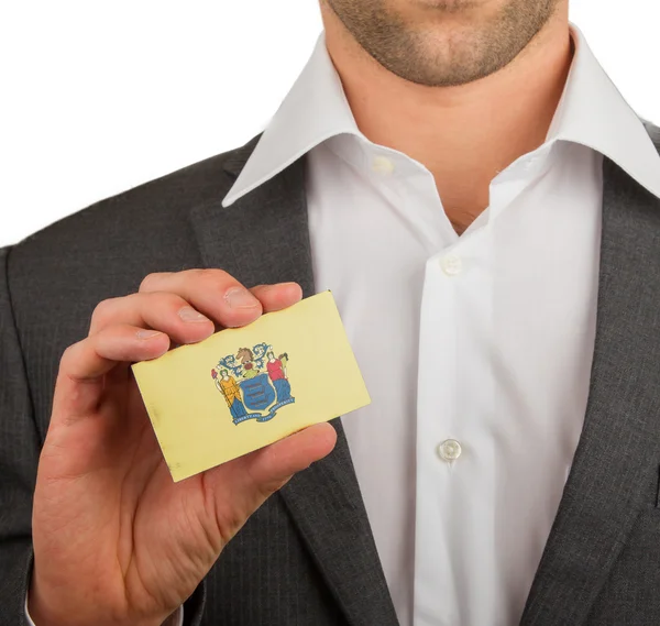 Businessman is holding a business card, New Jersey — Stock Photo, Image