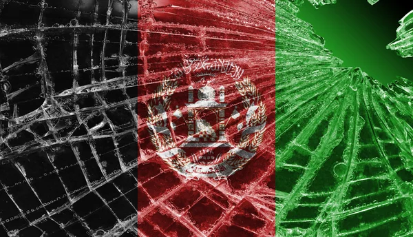 Trasiga is eller glas med en flagga mönster, afghanistan — Stockfoto