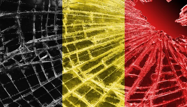 Gebroken ijs of glas met een vlag patroon, België — Stockfoto