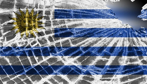 Gebroken ijs of glas met een vlag patroon, uruguay — Stockfoto