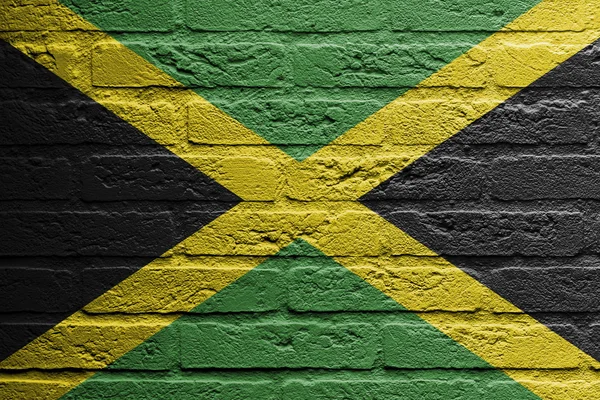 Ziegelwand mit einem Bild einer Fahne, Jamaica — Stockfoto