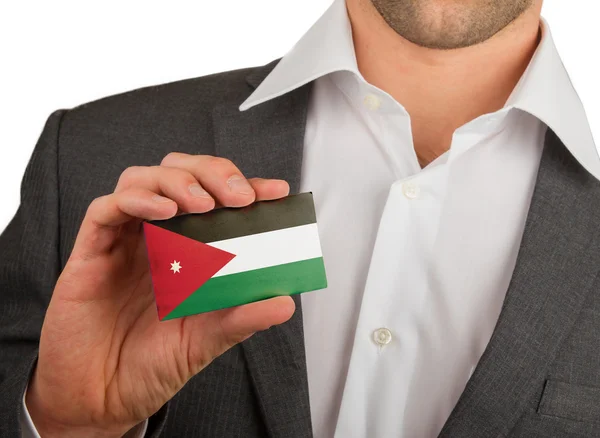 Empresário está segurando um cartão de visita, Jordan — Fotografia de Stock