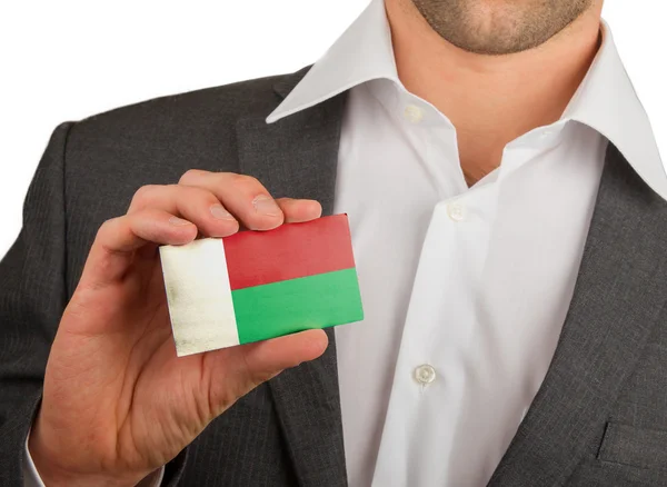 Businessman is holding a business card, Madagascar — Stock Photo, Image