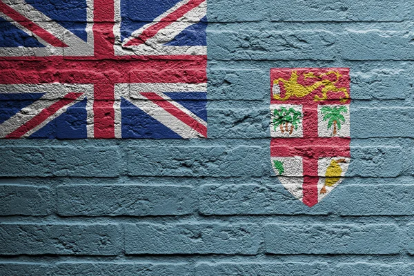 Mur de briques avec une peinture d'un drapeau, Fidji — Photo