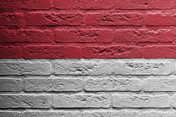 Bakstenen muur met een schilderij van een vlag, Indonesië — Stockfoto