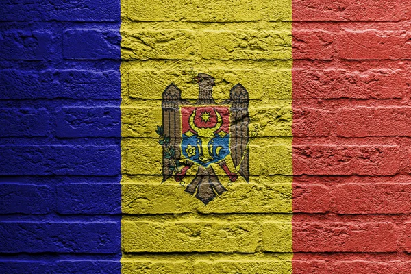 Brick wall with a painting of a flag, Moldavia — Stock Photo, Image