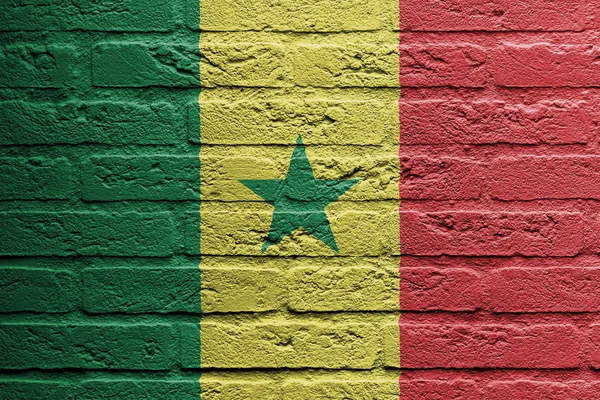 Ziegelsteinmauer mit einem Gemälde einer Flagge, Senegal — Stockfoto