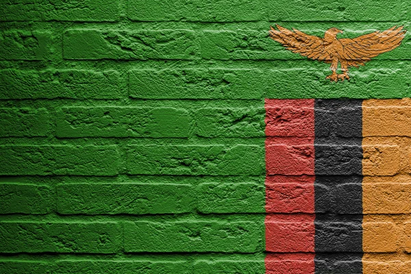 Ziegelsteinmauer mit einem Bild einer Flagge, Sambia — Stockfoto